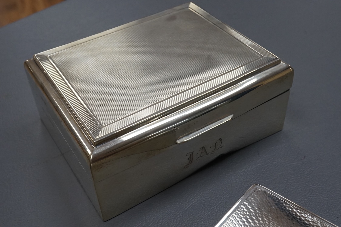 Three assorted silver mounted cigarette boxes, the largest by Frederick William Hentsch, London, 1924, 14.3cm.